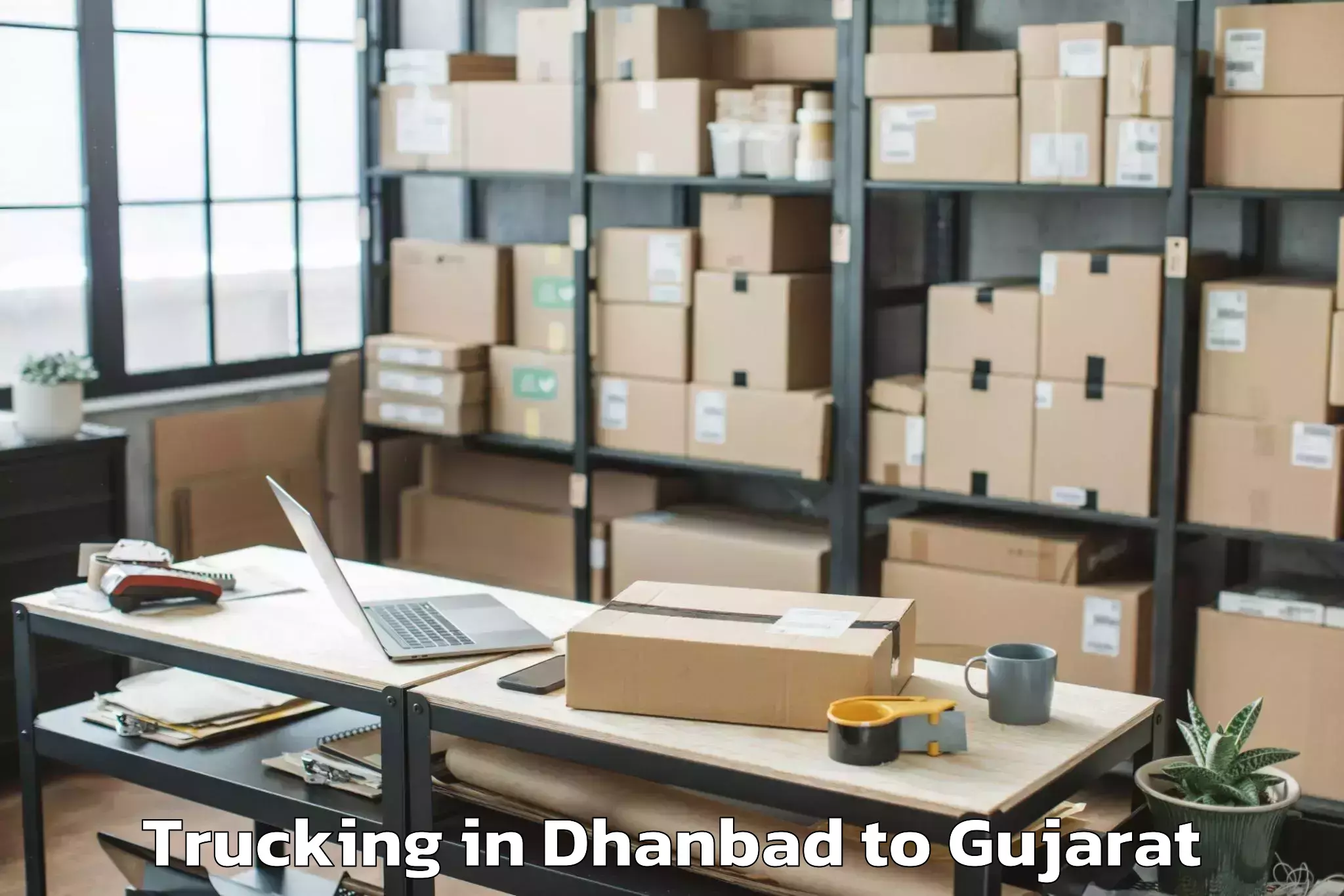 Book Dhanbad to Ahmedabad Airport Amd Trucking